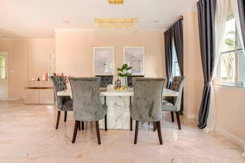 a dining room with a table and chairs at Top family house in peaceful area with lake view 3BR 15 mins to city in Chiang Mai