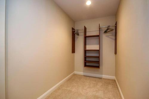 an empty room with a closet with shelves at Harbor apartments Free indoor Parking in Baltimore