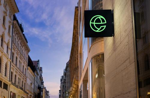 a green sign on the side of a building at elaya hotel leipzig city center in Leipzig