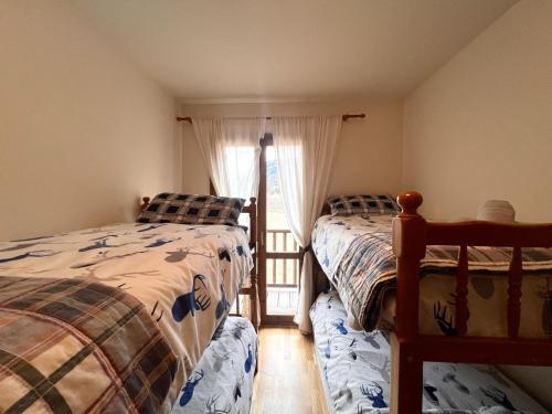 Postel nebo postele na pokoji v ubytování Dúplex d'Ainet - Vall de Cardós - L'Amfitriona