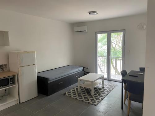 Ένα ή περισσότερα κρεβάτια σε δωμάτιο στο Appartement B