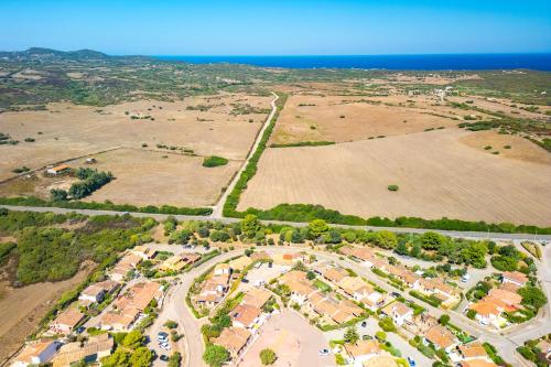 an aerial view of a suburb with houses and the ocean at Marelò in Vignola Mare