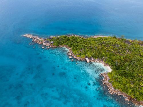 an aerial view of a tropical island in the ocean at Nid'Aigle Lodge in Anse Possession