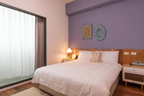 Una cama o camas en una habitación de 山沐三薰 2館 可包棟含蔬食早餐