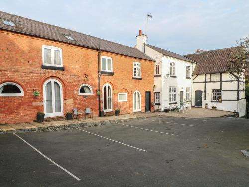 a parking lot in front of a brick building at Hayloft in Derby