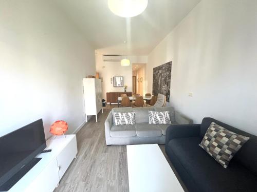 a living room with a couch and a tv at Triana CACTUS 2 in Melilla