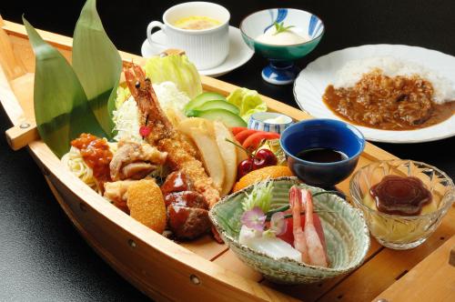 a wooden tray of food with seafood and vegetables on a table at Kouyurou Ikawa in Izunokuni