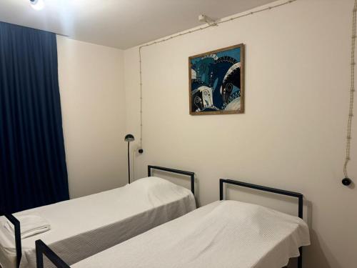 Postel nebo postele na pokoji v ubytování Sagule Hotel