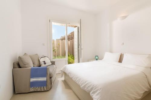Ένα ή περισσότερα κρεβάτια σε δωμάτιο στο Beachfront House 50m from the beach