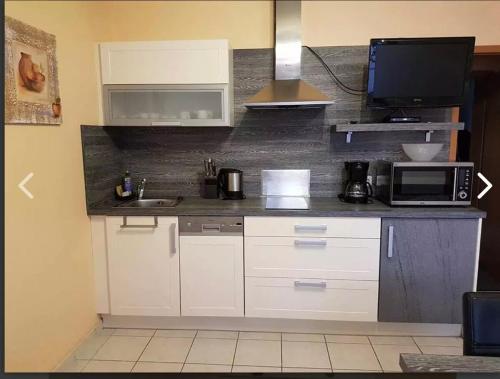 Η κουζίνα ή μικρή κουζίνα στο Apartment for 2 people Zimmervermietung Lang