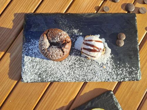 a plate with a doughnut and a piece of cake at MIA Urban Detroit Tanger in Tangier
