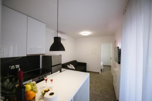 a kitchen with a white counter in a room at Luxury Villa Blue Sky in Široki Brijeg