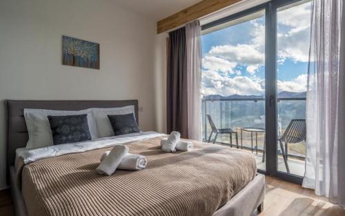 Ένα ή περισσότερα κρεβάτια σε δωμάτιο στο New Gudauri Apartments in Twins