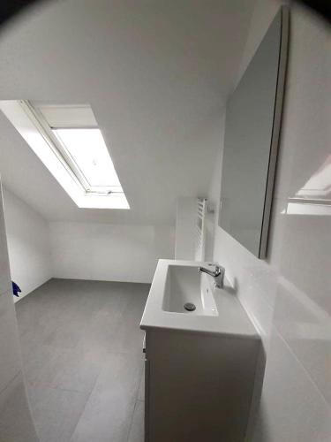 a white room with a sink and a skylight at Monteurwohnungen in Gera in Gera