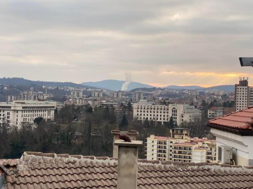 a view of a city with buildings in the background at Guest House Divna in Veliko Tŭrnovo