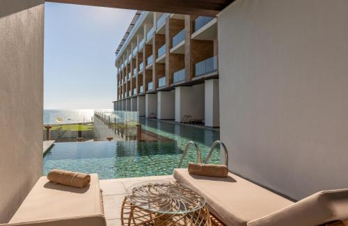 a view of the pool from the balcony of a building at Ethno Belek in Belek