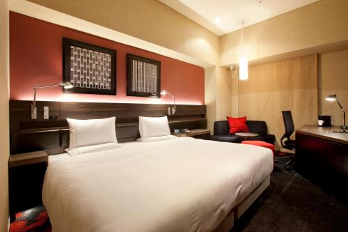 Cama o camas de una habitación en The Royal Park Hotel Iconic Tokyo Shiodome