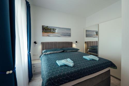 Postel nebo postele na pokoji v ubytování Apartman Anđela