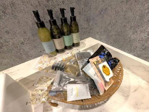 a table with three bottles of wine on it at ホテルサバナリゾートＡｄｕｌｔ Ｏｎｌｙ in Kishiwada