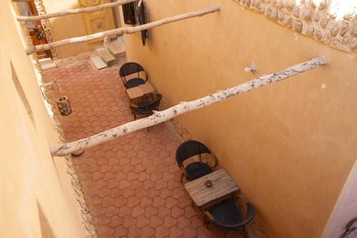 an overhead view of a room with sandals on a floor at People to People Siwa in Siwa