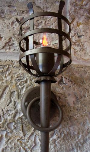 a metal torch with a fire inside of it at Ostsee-Rittergut-Rügen mit BinzHotel & OrdensKapelle & RomantikGut in Binz