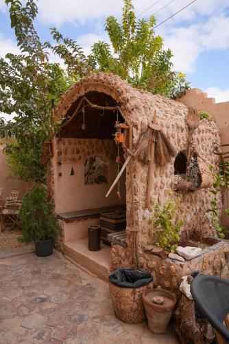 a small house made out of a stone building at People to People Siwa in Siwa