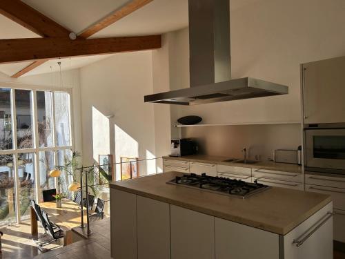 a kitchen with a stove and a counter top at Einzeldenkmal in der Altstadt von Regensburg in Regensburg
