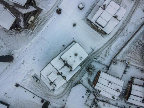an aerial view of a street covered in snow at Chalet Kalipe in Rocca Pietore