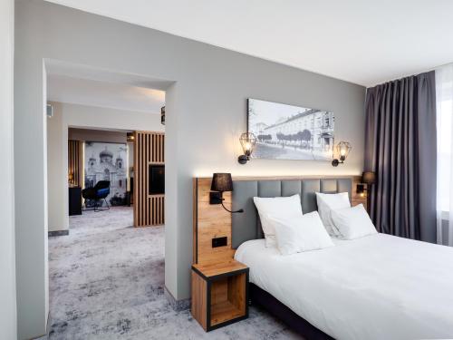 Posteľ alebo postele v izbe v ubytovaní Mercure Czestochowa Centrum