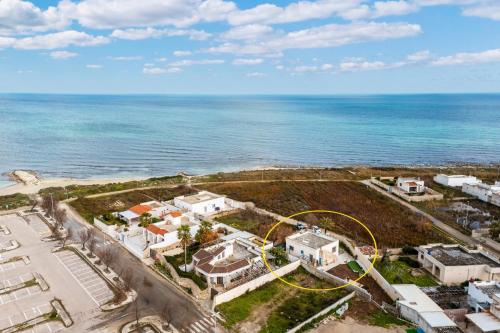 an aerial view of a house next to the ocean at Residenza Artistica by BarbarHouse in Torre Chianca