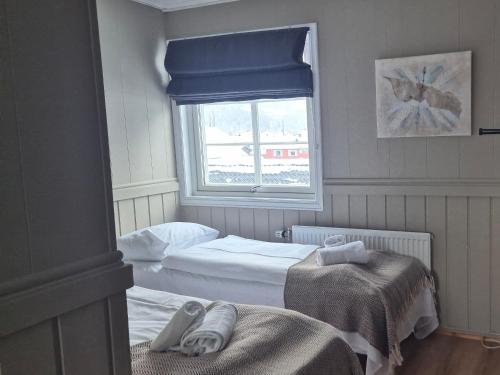 Postel nebo postele na pokoji v ubytování Vertshuset Fannarheimr - Bed &Breakfast