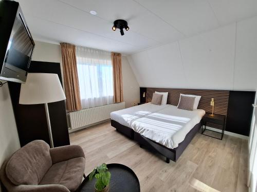 Ένα ή περισσότερα κρεβάτια σε δωμάτιο στο Hotel Randduin