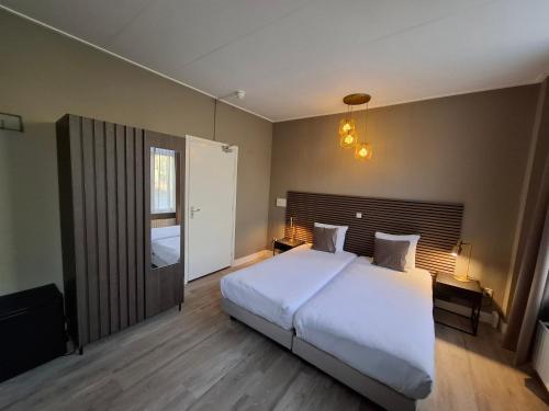 Ένα ή περισσότερα κρεβάτια σε δωμάτιο στο Hotel Randduin