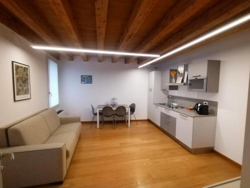 a living room with a couch and a table at Residenza Della Samaritana in Verona