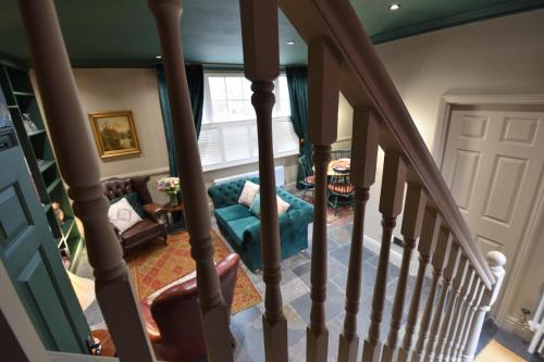 a stairway leading up to a living room with a stair case at Samuels' a duplex apartment by Spires Accommodation in Lichfield City Centre in Lichfield