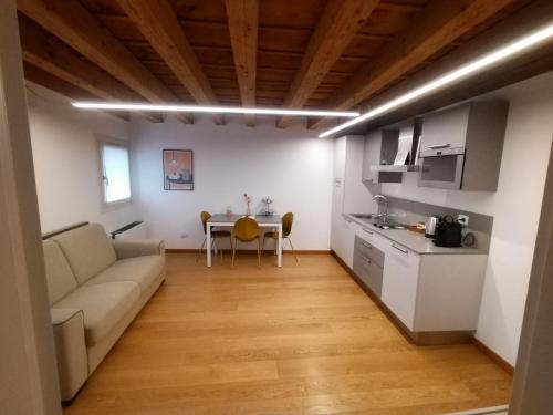 a living room with a couch and a table at Residenza Della Samaritana in Verona