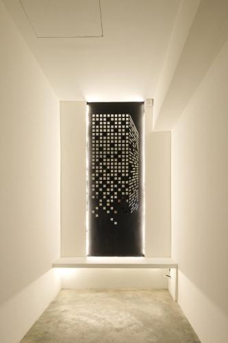 a room with a black grate on the wall at Loft 82 in Bukit Mertajam