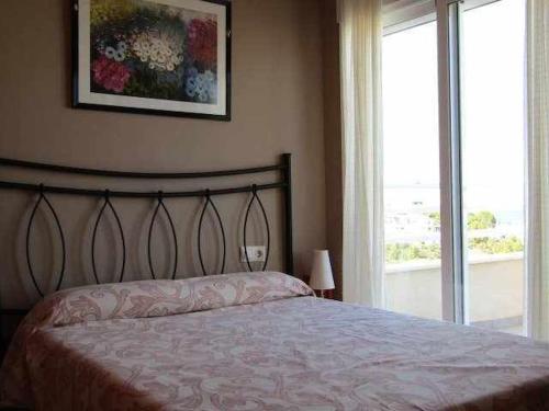 Posteľ alebo postele v izbe v ubytovaní A H RENTALS Montemar 8 apartamento