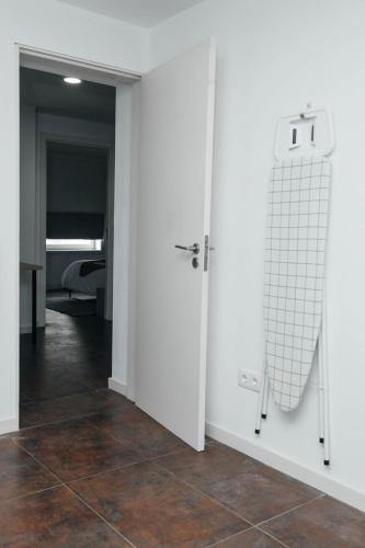 a room with white doors and a tiled floor at Ark of Aqua Flat in Porto