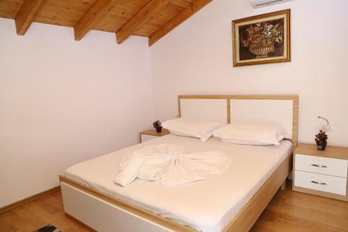 Postel nebo postele na pokoji v ubytování Vila Rino Berat
