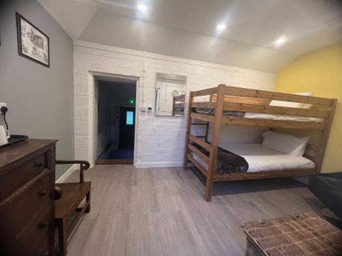 a room with two bunk beds and a hallway at Hilston Park in Monmouth