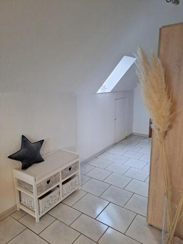 a room with a skylight and a table with a pillow at Ferienwohnung Sternschnuppe in Dülmen
