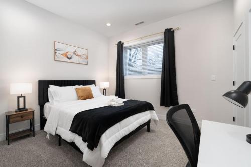 a bedroom with a large bed and a window at Gilean Urban Retreat in Chicago