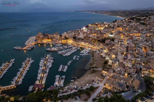 an aerial view of a harbor at night at Casa Mauro e Roberta Zingaro in Castellammare del Golfo