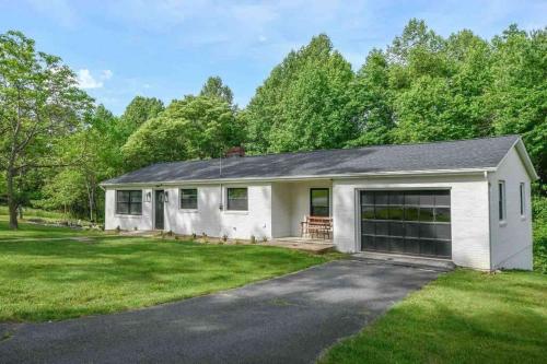 a large white house with a garage at Time to Wine Down - Family Home in Afton