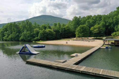 a dock with a boat on the water at Time to Wine Down - Family Home in Afton