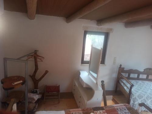 Ένα ή περισσότερα κρεβάτια σε δωμάτιο στο Kourtsa villas