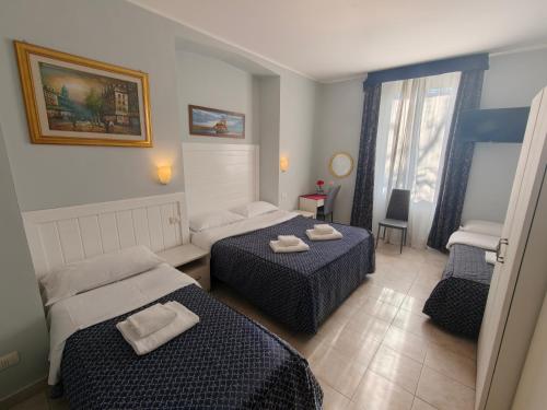 Postel nebo postele na pokoji v ubytování Hotel Aurelia Milano Centrale