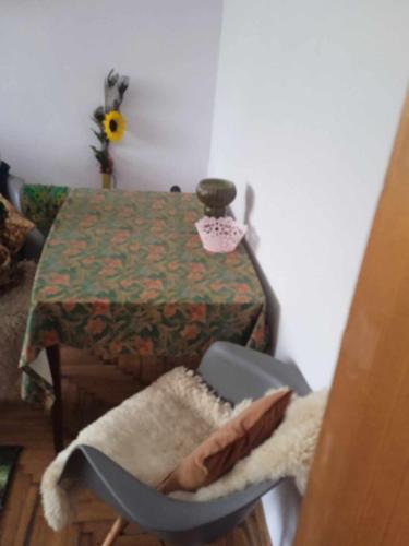 a room with a table and a chair next to a table at Біля автовокзалу in Lviv