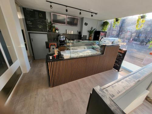 a fast food restaurant with a counter in a restaurant at BnB Souterrain in Amsterdam